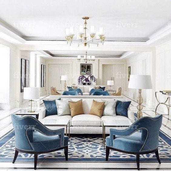 White sofa with blue armchairs.